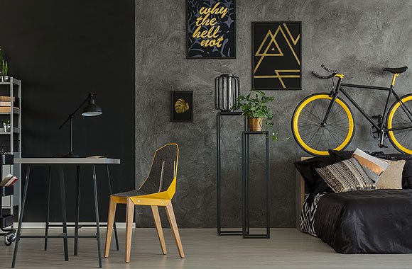 Studio apartment interior with a yellow accent chair